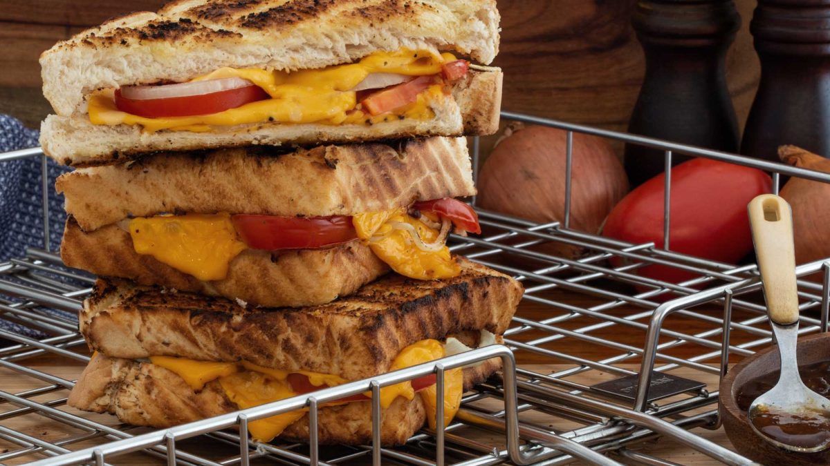 Traditional South African  Braaibroodjies (BBQ Toasties) with Cheese, Tomato and Onion