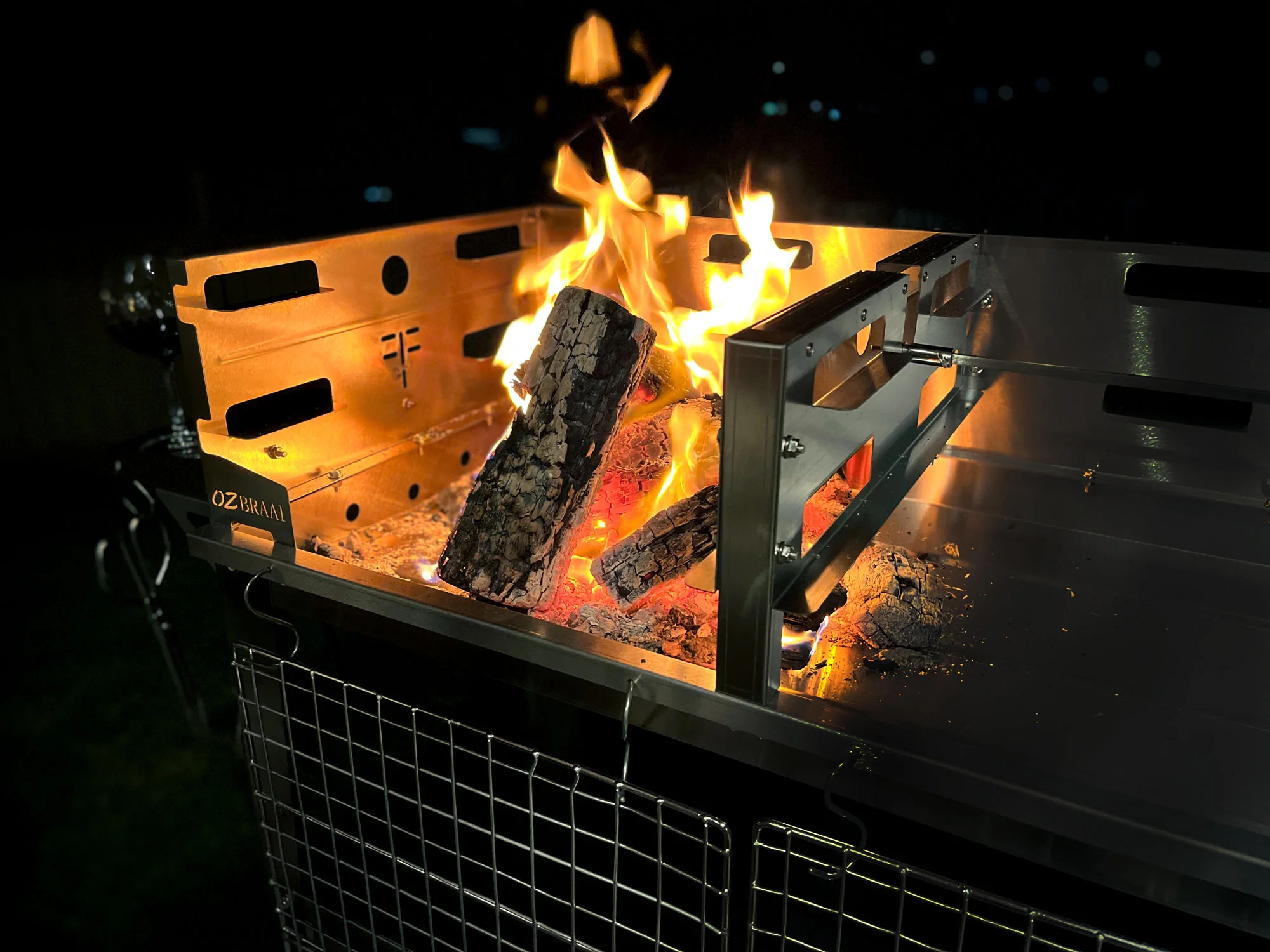 Picture of a Braai with a well lit fire.