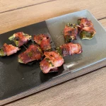 Bacon-wrapped jalapeño poppers on the Compact Braai