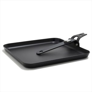 OXO Outdoor carbon steel griddle pan with the handle reversed for packing